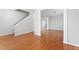 Open-concept living space with hardwood floors and neutral paint at 202 River Hills Dr, Clayton, NC 27527