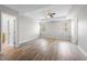 Spacious main bedroom features two windows, a ceiling fan, and tray ceiling at 202 River Hills Dr, Clayton, NC 27527