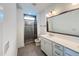 Modern bathroom with glass shower, vanity with dual sinks and stylish mirror at 208 Acorn Crossing Rd, Holly Springs, NC 27540
