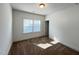 Bright bedroom featuring soft carpeting, a window with blinds, and a neutral color palette at 208 Acorn Crossing Rd, Holly Springs, NC 27540