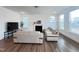 A cozy living room with a fireplace, hardwood floors, and comfortable seating at 208 Acorn Crossing Rd, Holly Springs, NC 27540