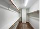 Spacious walk-in closet with ample shelving and storage for an organized wardrobe at 208 Acorn Crossing Rd, Holly Springs, NC 27540