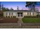 Charming duplex featuring a well-maintained lawn, fresh mulch, and classic design at 2209 Bernard St, Raleigh, NC 27608