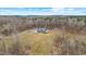 High angle view of the house nestled within a serene and wooded landscape at 2418 Crossroads Ave, Hillsborough, NC 27278