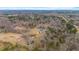 Sweeping aerial shot of the home showing the extensive property and surrounding woodland at 2418 Crossroads Ave, Hillsborough, NC 27278