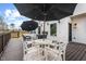 Charming back deck includes an outdoor dining table and a relaxing lounge area at 2418 Crossroads Ave, Hillsborough, NC 27278
