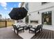 Stylish deck with a fireplace, lounge area, and views of the expansive yard at 2418 Crossroads Ave, Hillsborough, NC 27278