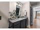 Well-lit bathroom vanity features a granite countertop and a modern mirror at 2418 Crossroads Ave, Hillsborough, NC 27278