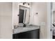 Elegant bathroom featuring a granite countertop vanity with a rectangular mirror at 2418 Crossroads Ave, Hillsborough, NC 27278