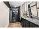 Modern bathroom features a glass-enclosed shower with black marble and granite countertop at 2418 Crossroads Ave, Hillsborough, NC 27278