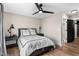 Cozy bedroom offers a ceiling fan, warm-toned walls, and matching bedside lamps at 2418 Crossroads Ave, Hillsborough, NC 27278