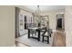 Charming dining room featuring a wooden table, bench seating, and a stylish chandelier for elegant gatherings at 2418 Crossroads Ave, Hillsborough, NC 27278