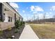 Charming two-story modern farmhouse with walkway, landscaped yard, and covered porch at 2418 Crossroads Ave, Hillsborough, NC 27278