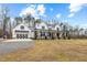 Charming two-story home with a large front yard and a spacious three car garage at 2418 Crossroads Ave, Hillsborough, NC 27278