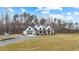 Picturesque two-story home featuring a front yard and a detached garage at 2418 Crossroads Ave, Hillsborough, NC 27278