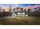 Stunning exterior of a modern farmhouse with a metal roof and detached shed at 2418 Crossroads Ave, Hillsborough, NC 27278