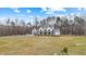 Stunning two-story modern farmhouse with a metal roof and a spacious lawn at 2418 Crossroads Ave, Hillsborough, NC 27278
