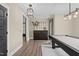 Elegant game room area showcasing a black pool table, modern lighting, and stylish decor at 2418 Crossroads Ave, Hillsborough, NC 27278