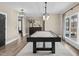 Stylish game room with a black pool table, modern lighting, and neutral decor for entertaining at 2418 Crossroads Ave, Hillsborough, NC 27278