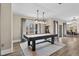 Spacious game room featuring a black pool table, with an open layout for social gatherings and fun at 2418 Crossroads Ave, Hillsborough, NC 27278