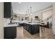 Modern kitchen featuring a large island, pendant lighting, and stainless steel appliances at 2418 Crossroads Ave, Hillsborough, NC 27278