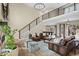 Open-concept living area with a staircase, comfortable seating, and views of the adjacent game room at 2418 Crossroads Ave, Hillsborough, NC 27278
