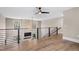 Open loft with views of living space, featuring modern metal railings and hardwood flooring at 2418 Crossroads Ave, Hillsborough, NC 27278