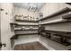 Spacious walk-in pantry with custom shelving for ample storage and organized kitchen supplies at 2418 Crossroads Ave, Hillsborough, NC 27278