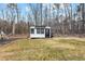 Small, modern shed or outbuilding with black trim and a functional door at 2418 Crossroads Ave, Hillsborough, NC 27278