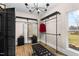 Walk-in closet with custom metal pipe shelving, dark features, and a view to the outside at 2418 Crossroads Ave, Hillsborough, NC 27278