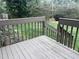 Cozy outdoor back deck provides a relaxing space to enjoy nature at 250 S Estes S Dr # Apt 113, Chapel Hill, NC 27514