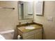 Cozy bathroom featuring a granite countertop, vanity, and well-lit mirror at 250 S Estes S Dr # Apt 113, Chapel Hill, NC 27514