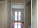 Spacious bedroom with hardwood floors and double doors leading to a balcony at 250 S Estes S Dr # Apt 113, Chapel Hill, NC 27514