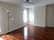 Bright bedroom with hardwood floors and a ceiling fan for added comfort at 250 S Estes S Dr # Apt 113, Chapel Hill, NC 27514