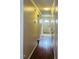 Welcoming hallway with hardwood floors and ample natural light leading to the front door at 250 S Estes S Dr # Apt 113, Chapel Hill, NC 27514