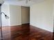 Open-concept living room with hardwood floors and ample natural light, perfect for gatherings at 250 S Estes S Dr # Apt 113, Chapel Hill, NC 27514