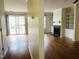 Open-concept layout with hardwood floors, a fireplace, and access to a private patio at 250 S Estes S Dr # Apt 113, Chapel Hill, NC 27514