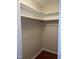 Spacious walk-in closet with ample shelving and a hanging rod for organized storage at 250 S Estes S Dr # Apt 113, Chapel Hill, NC 27514