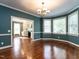 Charming dining room flows into the living room with large bay windows and hardwood floors at 2512 Winterbury Ct, Raleigh, NC 27607