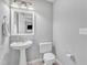 Well-lit half bath features a pedestal sink at 2520 Friedland Pl # 102, Raleigh, NC 27617