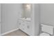 Bathroom with a sink vanity and toilet at 2520 Friedland Pl # 102, Raleigh, NC 27617