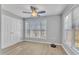 Comfortable bedroom with natural light, featuring a ceiling fan and spacious closet at 2520 Friedland Pl # 102, Raleigh, NC 27617