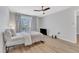 Modern bedroom boasts a ceiling fan and a scenic outdoor view at 2520 Friedland Pl # 102, Raleigh, NC 27617