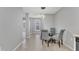 Open-concept dining area with modern lighting and stylish seating at 2520 Friedland Pl # 102, Raleigh, NC 27617