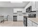 Efficient kitchen layout with stainless steel appliances and tile flooring at 2520 Friedland Pl # 102, Raleigh, NC 27617