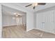 Spacious living room featuring a ceiling fan and wood-look flooring at 2520 Friedland Pl # 102, Raleigh, NC 27617