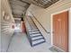 Apartment complex exterior stairwell to access various units with doors and unit numbers at 2520 Friedland Pl # 102, Raleigh, NC 27617