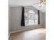 Bright primary bedroom with hardwood floors, vaulted ceiling, and large windows at 262 Tillamook Dr, Wake Forest, NC 27587