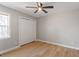 Well-lit bedroom with hardwood floors, neutral walls, closet, and window at 262 Tillamook Dr, Wake Forest, NC 27587