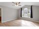 Primary bedroom with hardwood floors, vaulted ceiling, and large windows at 262 Tillamook Dr, Wake Forest, NC 27587